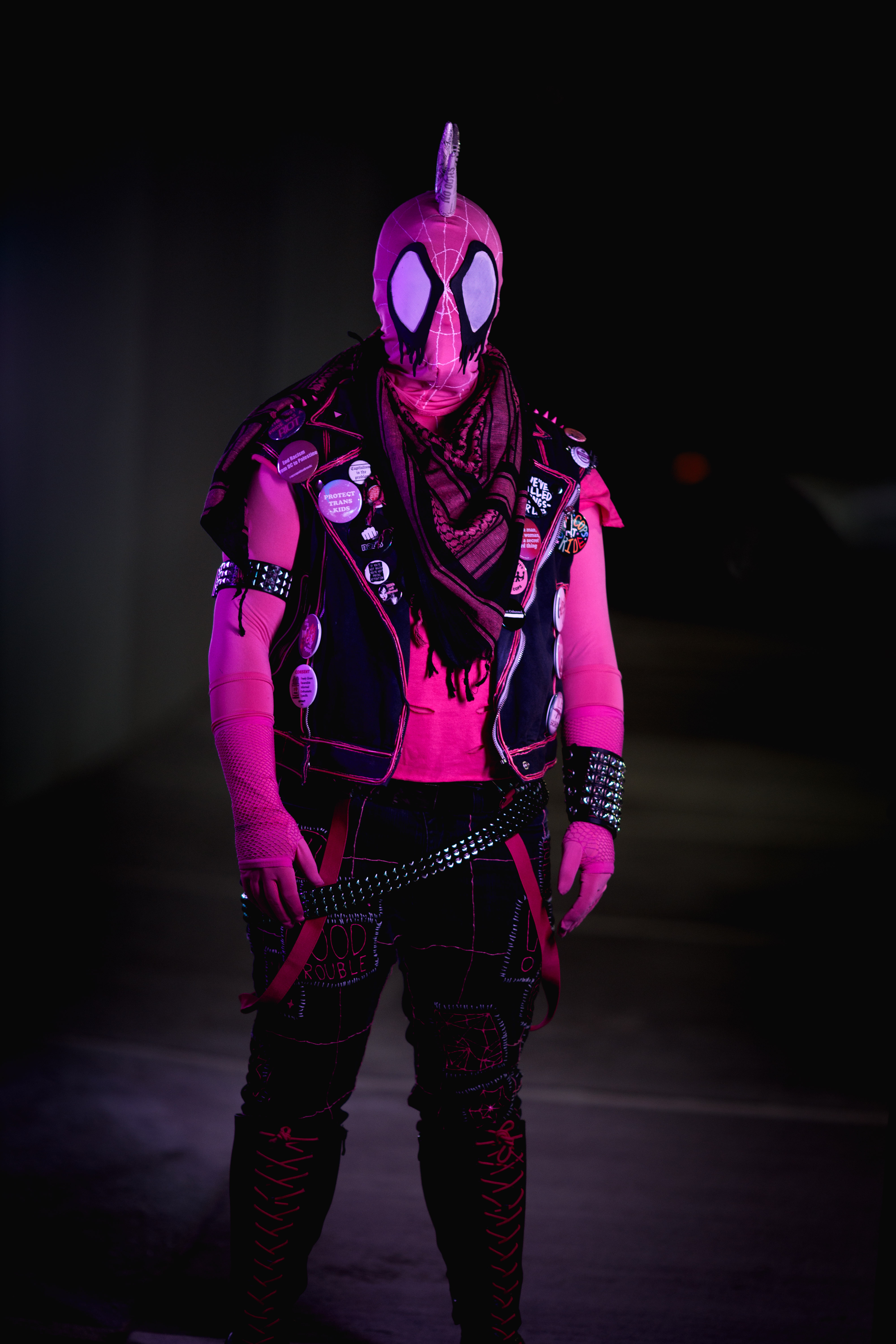 Spider-punk (pink palette) cosplayer wearing a pink keffiyeh